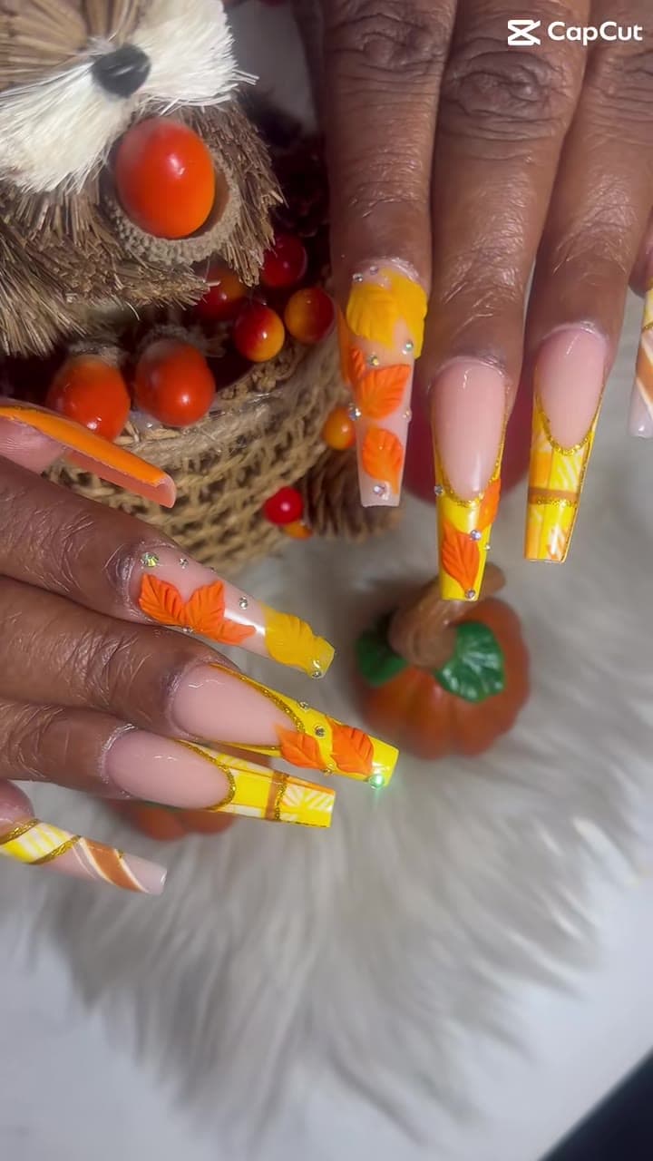 3D orange and yellow autumn leaves with a pumpkin prop — last fall at Gossip & Nail Spa South Side
