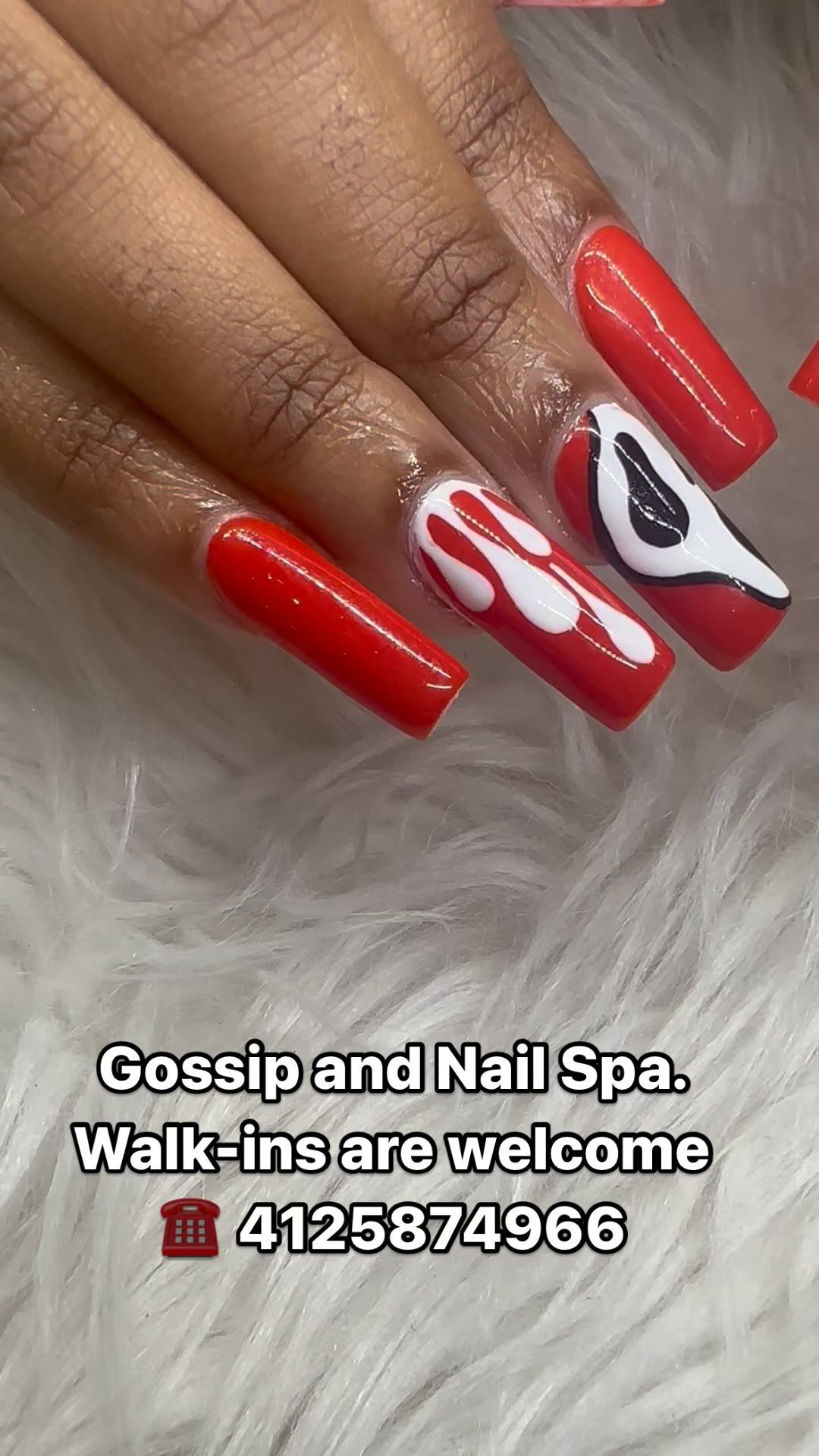 Red square nails with white drips and a Ghostface mask accent nail